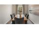 Dining room with a wood table, upholstered chairs, and modern decor at 1204 Pavo Path, Wendell, NC 27591