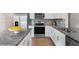 A well-equipped kitchen features granite counters and stainless steel appliances at 1204 Pavo Path, Wendell, NC 27591