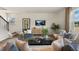 Inviting living room with comfortable seating, large windows, and an open layout at 1204 Pavo Path, Wendell, NC 27591