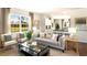 Open concept living space offering seating and seamless flow to the kitchen and dining area at 1204 Pavo Path, Wendell, NC 27591