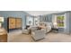 Spacious primary bedroom with seating, a cozy bed, and natural light at 1204 Pavo Path, Wendell, NC 27591