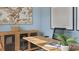 Office space with a wood desk, blue walls, and a decorative cabinet at 1204 Pavo Path, Wendell, NC 27591