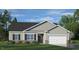 Charming single-story home featuring a two-car garage, a well-manicured lawn, and an inviting facade at 1208 Pavo Path, Wendell, NC 27591