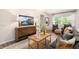 Comfortable living room showcasing stylish decor, plush seating, and hardwood floors at 1208 Pavo Path, Wendell, NC 27591