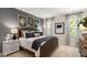 Serene main bedroom featuring neutral tones, large windows, and comfortable bedding at 1208 Pavo Path, Wendell, NC 27591
