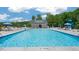 Community pool featuring lounge chairs and a splash-pad at Anderson Farm community at 1208 Pavo Path, Wendell, NC 27591