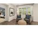 Cozy sitting area with plush chairs, natural light, and artwork at 1208 Pavo Path, Wendell, NC 27591