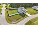 Wide aerial view showing a home's large yard enclosed by white fencing and a paved driveway at 1209 Huffington Oak Dr, Willow Springs, NC 27592