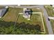 Aerial view of home with white fence surrounding the backyard and solar panels on the roof at 1209 Huffington Oak Dr, Willow Springs, NC 27592