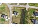An aerial view features a home with solar panels and a fenced-in backyard at 1209 Huffington Oak Dr, Willow Springs, NC 27592