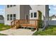 Wood deck with stairs and a small concrete patio area at 1209 Huffington Oak Dr, Willow Springs, NC 27592