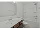Neutral bathroom with a combined tub and shower and a stylish vanity at 1209 Huffington Oak Dr, Willow Springs, NC 27592