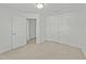 Bright, spacious bedroom with double doors and ample closet space in a well-lit setting at 1209 Huffington Oak Dr, Willow Springs, NC 27592