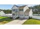 Charming two-story home featuring a two-car garage, fenced yard, and inviting front entrance at 1209 Huffington Oak Dr, Willow Springs, NC 27592