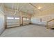 Spacious unfinished garage with ample space for multiple vehicles and storage at 1209 Huffington Oak Dr, Willow Springs, NC 27592