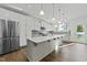 A well-appointed kitchen features a central island and stainless steel appliances, perfect for modern living at 1209 Huffington Oak Dr, Willow Springs, NC 27592