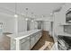 Spacious, open kitchen featuring a large island, pendant lighting, and stainless steel appliances at 1209 Huffington Oak Dr, Willow Springs, NC 27592