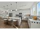 Open-concept kitchen with gray cabinets, stainless steel appliances, a large island, and pendant lighting at 1209 Huffington Oak Dr, Willow Springs, NC 27592