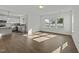 An open-concept living space seamlessly integrates the kitchen and dining area for modern living at 1209 Huffington Oak Dr, Willow Springs, NC 27592