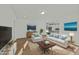 Serene living room featuring plush seating, a colorful rug, and artwork, creating a cozy atmosphere at 1209 Huffington Oak Dr, Willow Springs, NC 27592