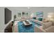 Bright living room with modern furnishings, a large window, and vibrant blue accents at 1209 Huffington Oak Dr, Willow Springs, NC 27592