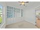 Bright office space showcasing built-in cabinetry, neutral carpet, and ample natural light at 1209 Huffington Oak Dr, Willow Springs, NC 27592