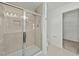 Glass shower stall with tiled walls, modern fixtures, and recessed lighting at 1209 Huffington Oak Dr, Willow Springs, NC 27592