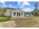 Spacious backyard with wood deck, patio, and lawn, offering plenty of outdoor space at 124 Maluli Dr, Oxford, NC 27565