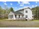 Exterior of the home's backyard with deck, patio, and well-maintained lawn at 124 Maluli Dr, Oxford, NC 27565