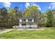Charming two-story home with a classic design and a well-maintained front lawn at 124 Maluli Dr, Oxford, NC 27565