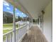 Inviting front porch with white railings, offering a relaxing outdoor space at 124 Maluli Dr, Oxford, NC 27565