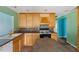 Functional kitchen with light wood cabinets and an island cooktop at 124 Maluli Dr, Oxford, NC 27565