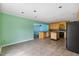 Bright kitchen with tile floors, wood cabinets, a center island, and plenty of natural light at 124 Maluli Dr, Oxford, NC 27565