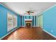 Spacious living room featuring a fireplace, built-in shelves and parquet floors at 124 Maluli Dr, Oxford, NC 27565