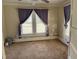 Bright bedroom with neutral carpet and light-filled windows at 1278 Valley Ct, Zebulon, NC 27597