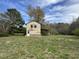 Rustic two-story house on sprawling lot presents an opportunity for renovation at 1278 Valley Ct, Zebulon, NC 27597