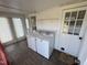 Convenient laundry room with washer, dryer, and ample natural light at 1278 Valley Ct, Zebulon, NC 27597