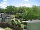 Scenic aerial view of a neighborhood with lush greenery and various residential homes at 1308 Wake Forest Rd, Raleigh, NC 27604