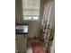 Bright bathroom featuring a floral shower curtain, and a sink with a black countertop at 1308 Wake Forest Rd, Raleigh, NC 27604