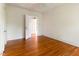 Bedroom with hardwood floors, ceiling fan, and traditional trim at 1308 Wake Forest Rd, Raleigh, NC 27604