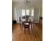 Traditional dining room with hardwood floors, and dining table with seating for four at 1308 Wake Forest Rd, Raleigh, NC 27604