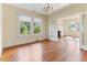 Well-lit dining room with hardwood flooring and access to the cozy living room at 1308 Wake Forest Rd, Raleigh, NC 27604