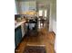 Bright, functional kitchen with stainless steel appliances and view into dining room at 1308 Wake Forest Rd, Raleigh, NC 27604