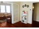 Light-filled living room with stylish decor and hardwood floors, with view into another room at 1308 Wake Forest Rd, Raleigh, NC 27604