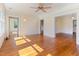 Bright living room with hardwood floors, large windows, and classic architectural details at 1308 Wake Forest Rd, Raleigh, NC 27604