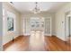 Open-concept living and dining area with hardwood floors and abundant natural light at 1308 Wake Forest Rd, Raleigh, NC 27604