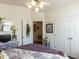 Bedroom featuring a ceiling fan, closet, and decorative accents, combining comfort and style for a peaceful retreat at 132 Crystal Pl, Benson, NC 27504