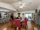 Open-concept dining room with hardwood floors and access to the sunroom at 132 Crystal Pl, Benson, NC 27504