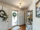 Charming entryway with a decorative wreath on the front door and elegant interior accents at 132 Crystal Pl, Benson, NC 27504