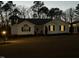 Traditional home featuring white siding, black shutters, a covered carport, and a well-manicured lawn at 132 Crystal Pl, Benson, NC 27504